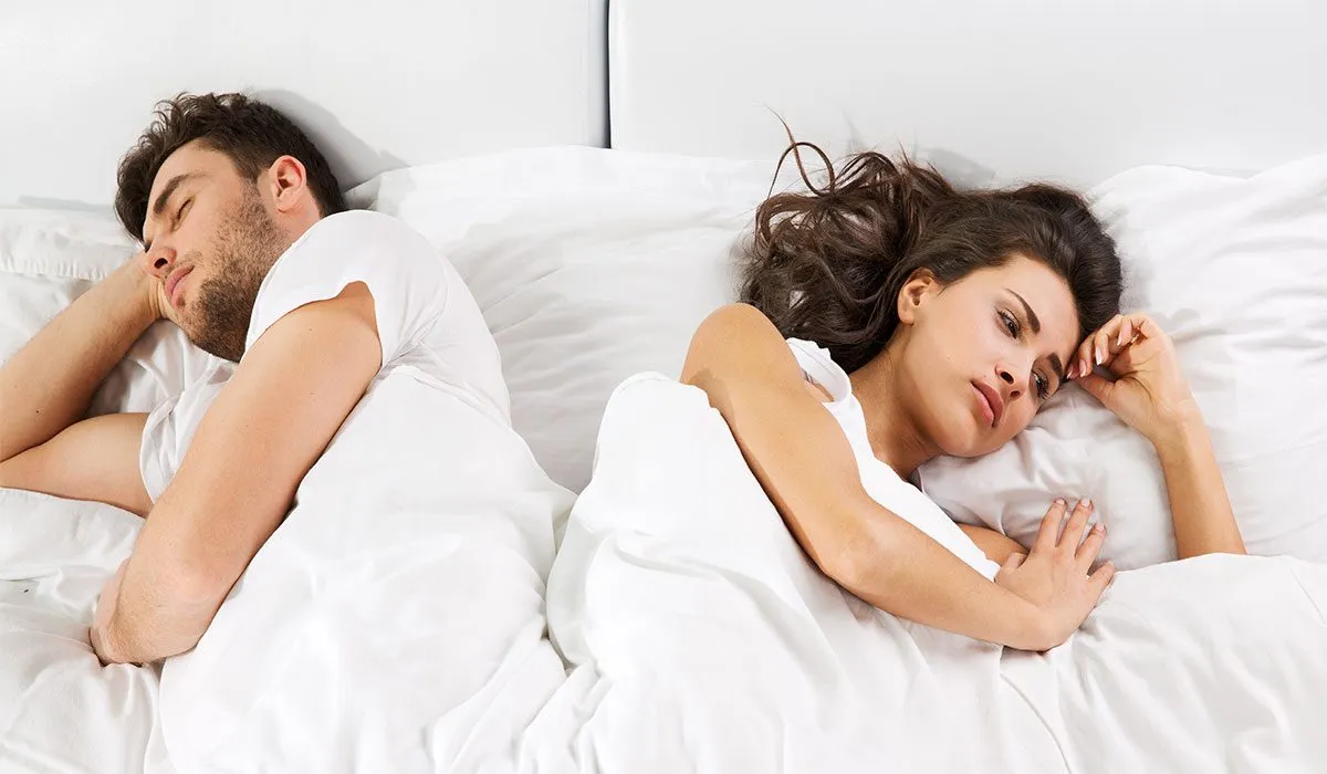 a man and woman on the bed